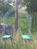 Ornamental iron trellis; garden arch with benches