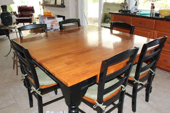 Large square kitchen table with leaf and 6 chairs.