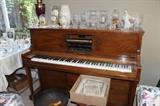 National Piano Company player piano with stool and huge selection of lead crystal. 8 clocks of various styles.