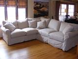 Arhaus Sectional. Only one year old and only used for a bit in a summer home. Great value Slipcovered sectional. Slipcovers remove for easy cleaning. Neutral MIni stripe