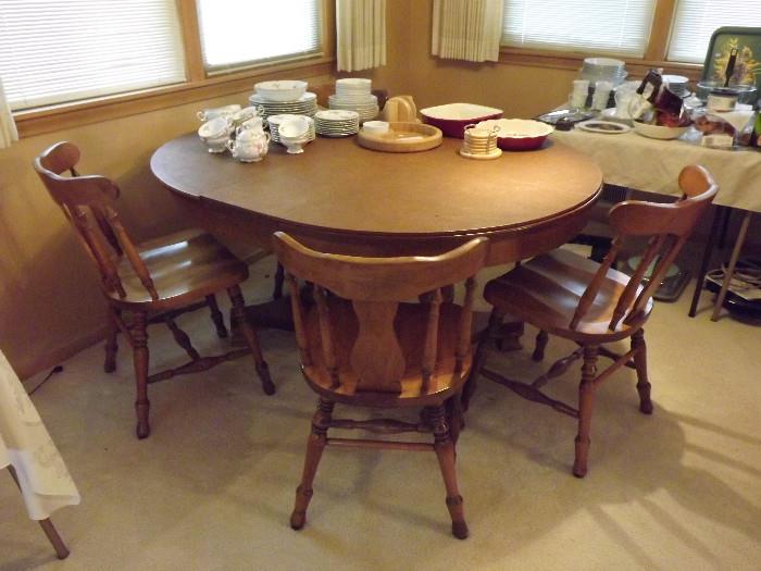 Round maple table and 4 chairs; table includes pads