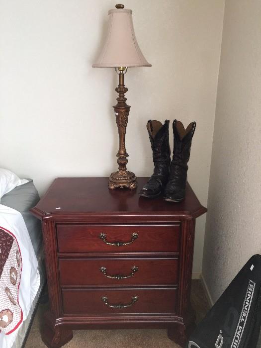 Night stand, cowboy boots, lamp, tennis racquet