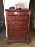 tall chest of drawers, books