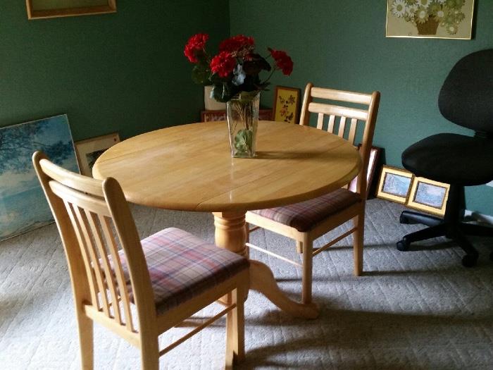 Solid wood cafe style table with drop down sides and two matching chairs