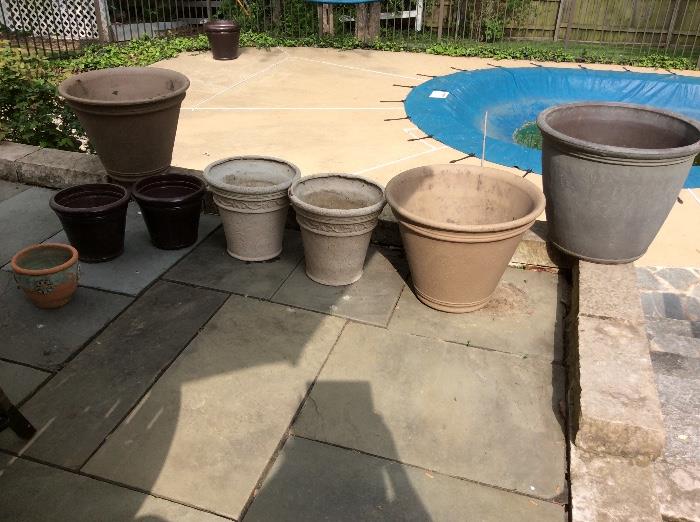 several outdoor pots, all sizes