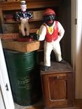 cast iron black lawn jockey, large Iten biscuit tin, cast iron Uncle Sam figurine