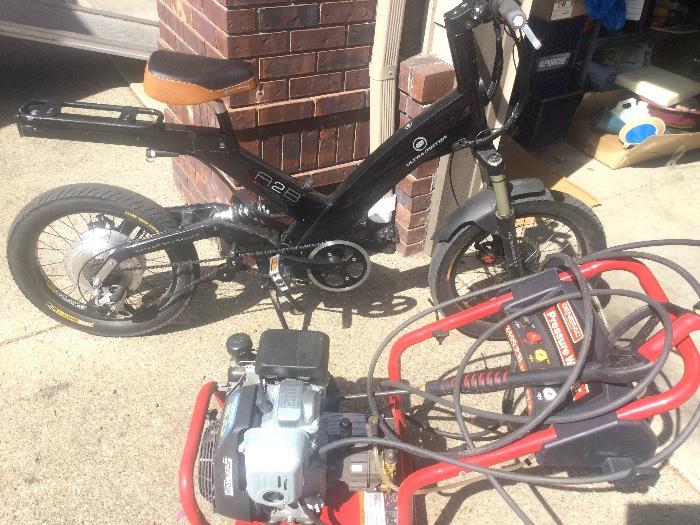 Electric Ultramotor A2B electric bike and Honda powered pressure washer