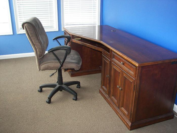 wooden desk and office chair
