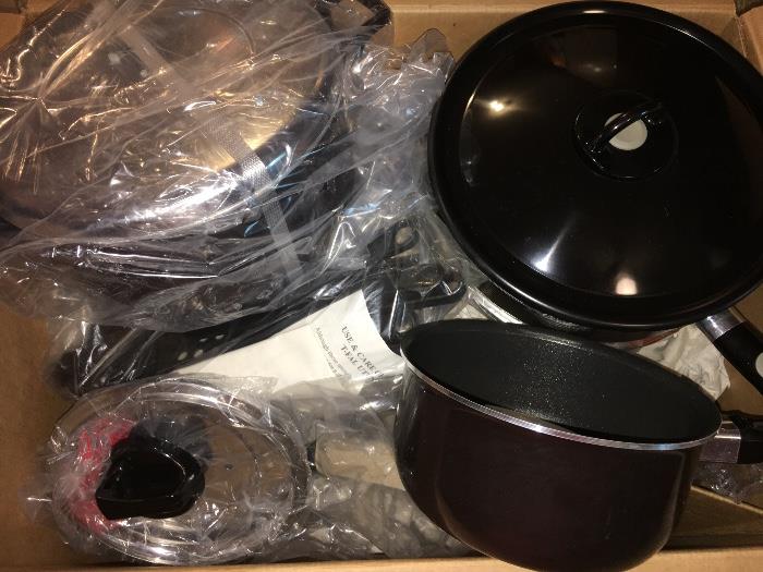 Big box of new-in-packaging T-Fal cookware. Many other new-in-box pots and pans, small appliances and other kitchenry.