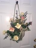 Assorted floral wreaths and arrangements.