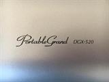 Yamaha Portable Grand DGX-520 electric keyboard with bench.
