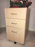 Natural finish 3-drawer file cabinet.