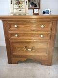 Sold oak bedroom group by Jamestown Sterling. Set includes large dresser with 3-way mirror, chest on chest, two nightstands and queen size bed. Just replace the hardware for a quick update.