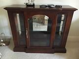 Beautiful beveled glass curio console cabinet.