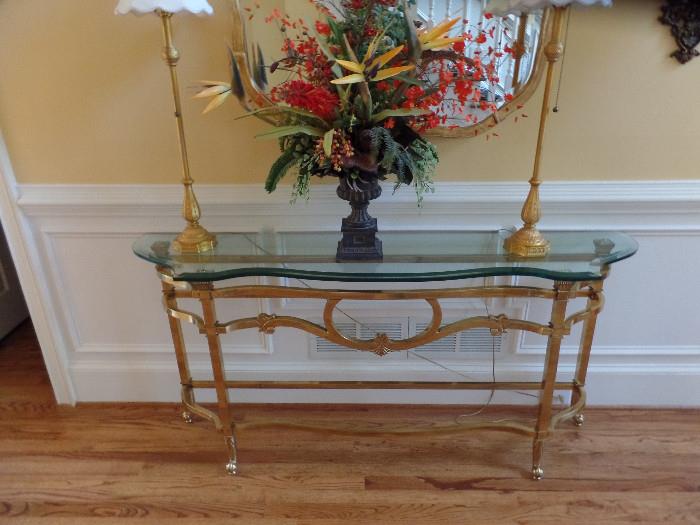 One of many Floral arrangements $20 and up Console table and mirror 