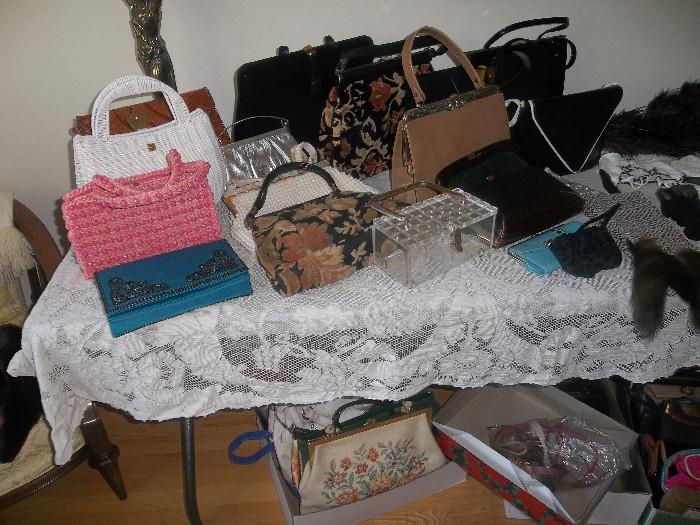Loads of purses many are vintage and antique