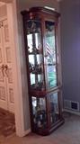 Large lighted curio cabinet. please note the right side is missing glass on top side level