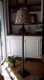 Decorative floor lamp with acorn top and fish net covered shade