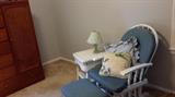 Glider chair and ottoman with white wicker night stand