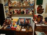 Some Smaller Dolls and a Great old Treadle Machine in Special Oak Cabinet. Heavy Brass Chain pulls machine into place when top is opened.