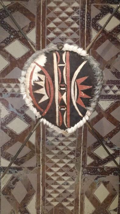African masks, shield, spears