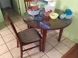 Breakfast table with two chairs, storage containers, mixing bowls