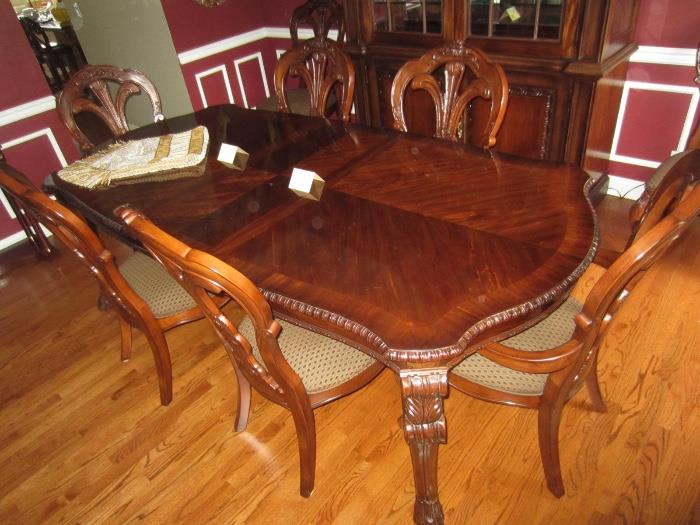Bernhardt dining table with 2 leaves and 8 chairs, pads included