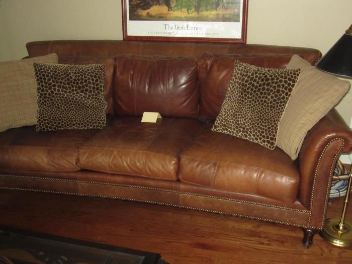 Plunkett leather sofa with brass nailhead embellishments