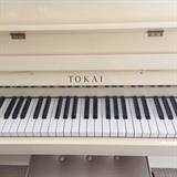White Tokai Japanese upright piano and bench