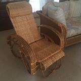 Wicker rocker with attached slide out foot rest