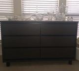 Midcentury chest with Dake Tiffany, lead crystal, and other decorative pieces on top