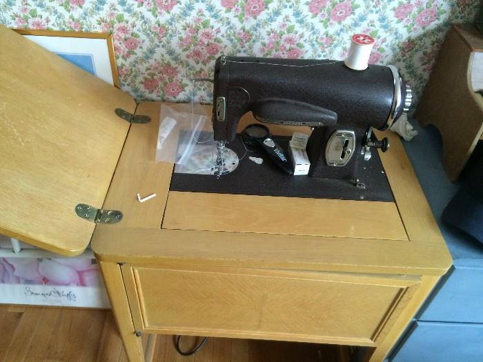 Table-top sewing machine, also Portable model available(not shown). 