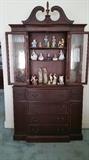 Mahogany secretary with two glass door.  Top drawer has shelf. 