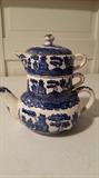 Tea pot, creamer and sugar stacked 