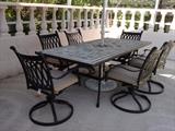 Tile top table with 6 swivel chairs.