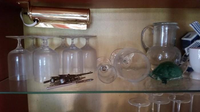 Water glasses and pitcher, glass turtle, windmill, and antique drafting tools