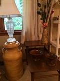 painted milk can, glass lamp, two tier side table