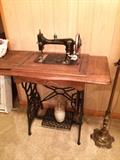 Minnesota treadle sewing machine in cabinet