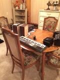 keyboard, oval dining table with 4 chairs