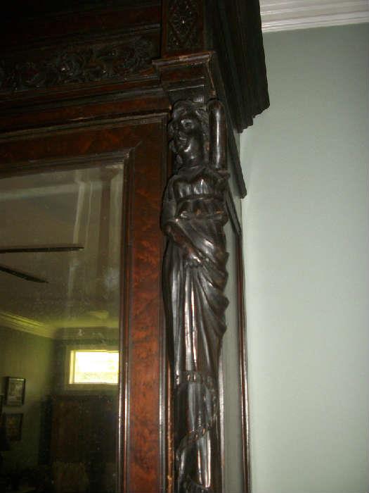 just a few carvings on this fantastic armoire