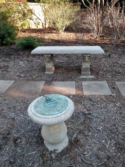 This concrete bench is also in the sale, but not the Swiss Sundial.