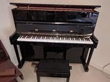 For the ivory tickler in your life, enter the Czechoslovakian black lacquer upright piano, w/matching stool.