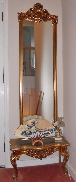 Gilt foyer console with mirror above