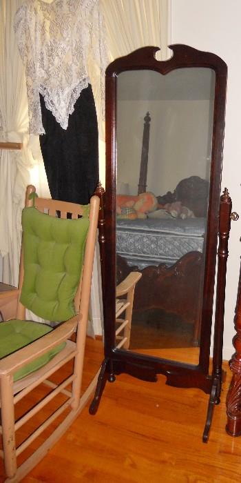 Free standing full length mirror and natural colored wooden rocker