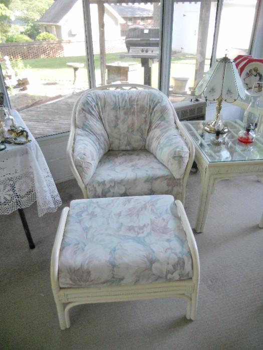 White rattan chair and ottoman in floral