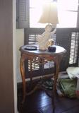Cute little Putti lamp standing on a nice occasional table