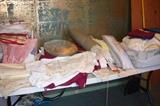A large number of vintage table linens and some bed linens too