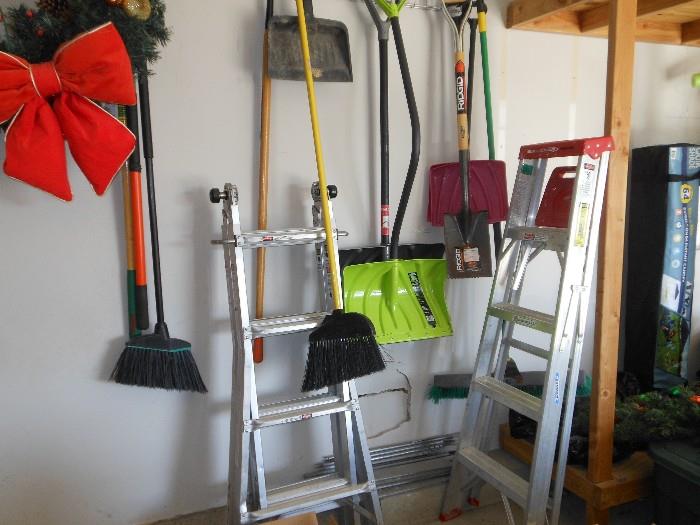 brooms shovels and ladder 