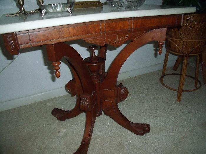 fancy wood base of antique table