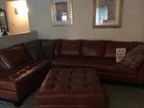 Incredible designer leather couch in a rich supple leather with huge ottoman which opens and has storage ! Client paid over $4,000 for this beauty ! 
